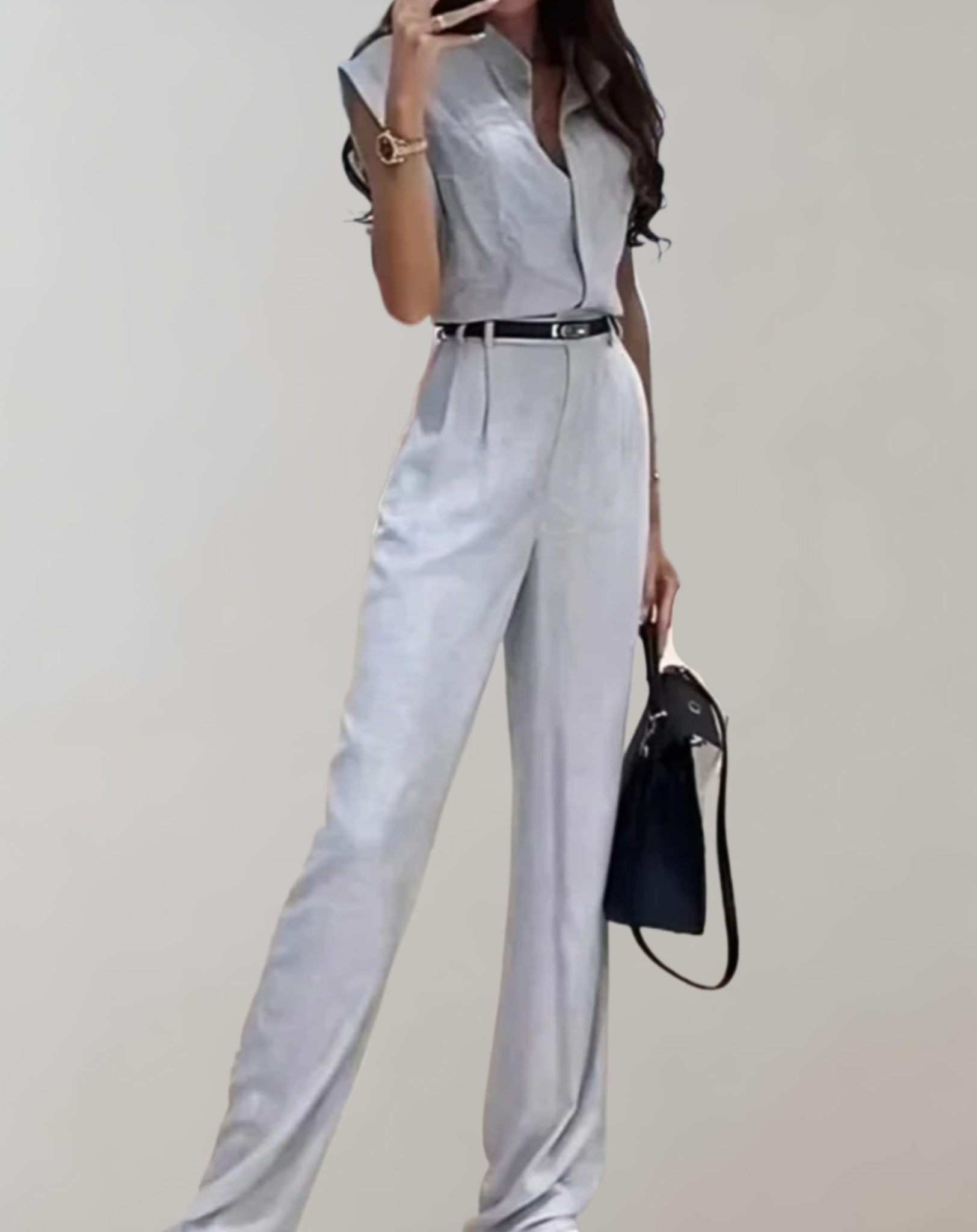 Trina - mouwloze jumpsuit met riem, knopen en broek met wijde pijpen